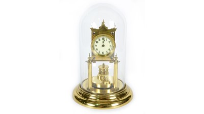 Lot 1180 - A 20th Century German brass anniversary clock.