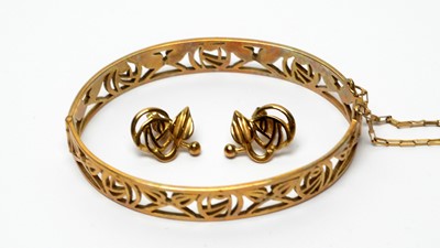 Lot 217 - A 9ct yellow gold Charles Rennie Mackintosh rose bangle; and matching earrings