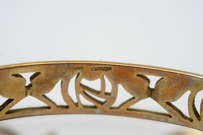 Lot 217 - A 9ct yellow gold Charles Rennie Mackintosh rose bangle; and matching earrings