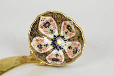 Lot 721 - A Royal Crown Derby 'Old Imari' solid gold band soup ladle