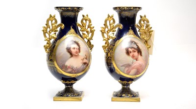 Lot 444 - A pair of Royal Vienna style twin handled vases.