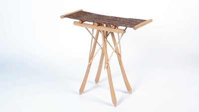 Lot 8 - Guy Martin: a wicker and turned oak table.