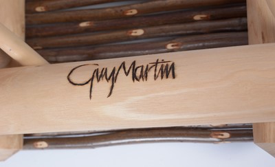 Lot 8 - Guy Martin: a wicker and turned oak table.