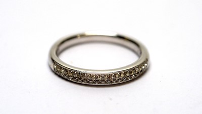 Lot 103 - A diamond half hoop eternity ring