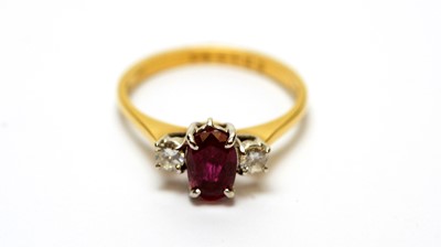 Lot 107 - A ruby and diamond cluster ring