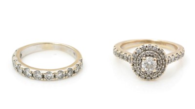 Lot 473 - A diamond cluster engagement ring half hoop eternity wedding band