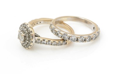 Lot 473 - A diamond cluster engagement ring half hoop eternity wedding band