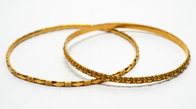 Lot 140 - Two 22ct yellow gold bangles
