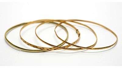 Lot 142 - Four 9ct yellow gold bangles