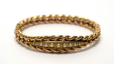 Lot 143 - A late Victorian 14ct yellow gold and graduated half pearl bangle
