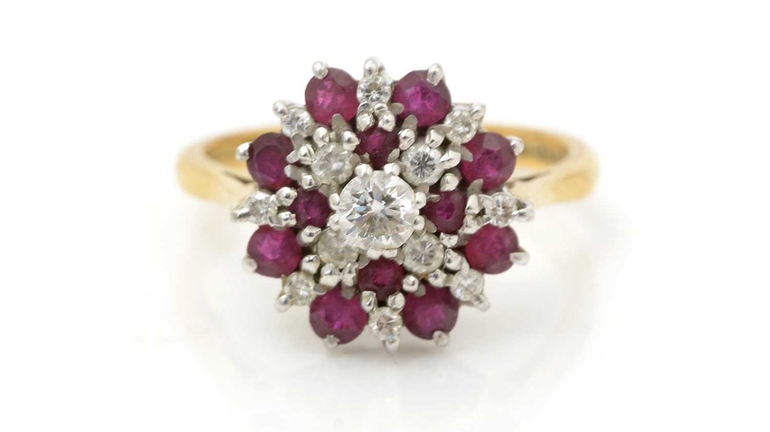 Lot 476 - A ruby and diamond cluster ring