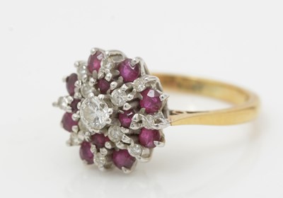 Lot 476 - A ruby and diamond cluster ring