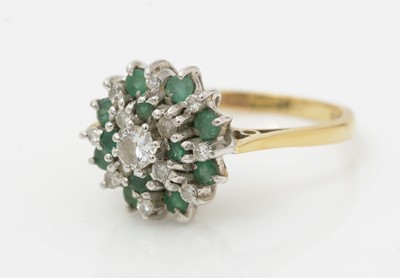 Lot 477 - An emerald and diamond cluster ring