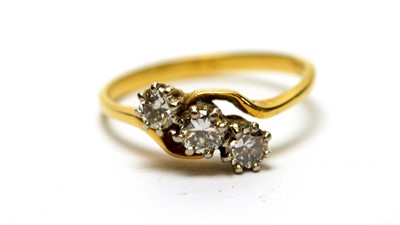 Lot 197 - A three stone diamond ring
