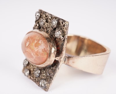 Lot 1155 - A fire opal and diamond ring