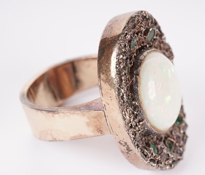 Lot 1156 - A white opal and emerald ring