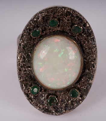 Lot 1156 - A white opal and emerald ring