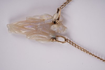 Lot 1160 - A Chinese carved opal pendant