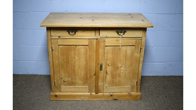 Lot 56 - A Victorian-style pine side cabinet.