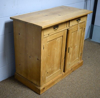 Lot 56 - A Victorian-style pine side cabinet.