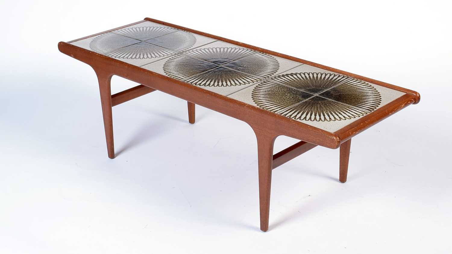 Lot 11 - A mid Century teak tile-top coffee table.