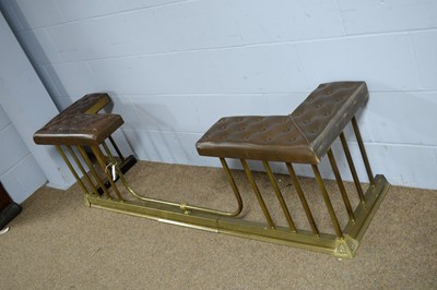 Lot 66 - A Victorian-style brass and button upholstered club fender.