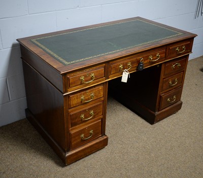 Lot 38 - An Edwardian mahogany twin-pedestal writing desk.