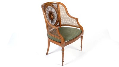 Lot 1157 - An early 20th Century painted satinwood bergere armchair in the Regency taste