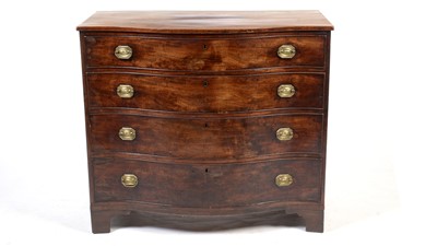 Lot 1158 - Georgian mahogany serpentine chest.