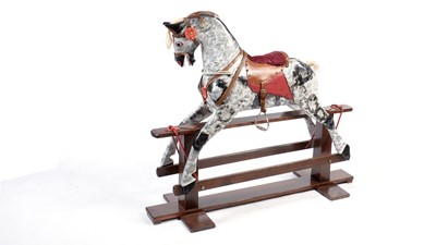 Lot 1085 - A vintage wooden dapple-grey rocking horse.