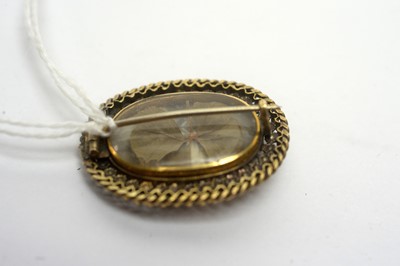 Lot 188 - A mourning brooch; and two others.