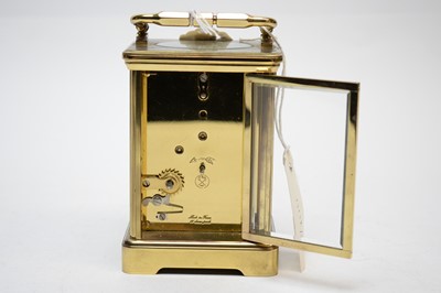 Lot 259 - A 20th Century Angelus brass cased carriage clock.