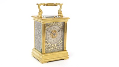 Lot 1036 - An ornate French brass carriage clock