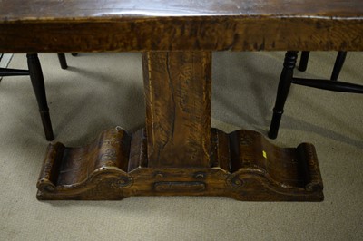 Lot 71 - A substantial Jacobean style carved oak refectory dining table..