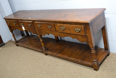 Lot 31 - Attributed to Titchmarsh and Goodwin: an 18th Century style oak dresser.