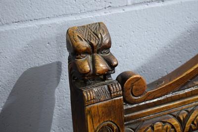 Lot 44 - N.H. Chapman & Co. Ltd. of Newcastle: a Jacobean-style carved oak hall seat.