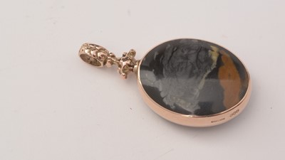 Lot 132 - A 9ct rose gold pendant, together with a garnet ring