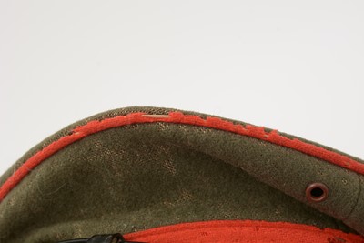 Lot 823 - A Japanese Imperial army student's cap; and two puttee straps.