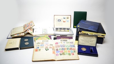Lot 381 - A collection of coins and stamps.