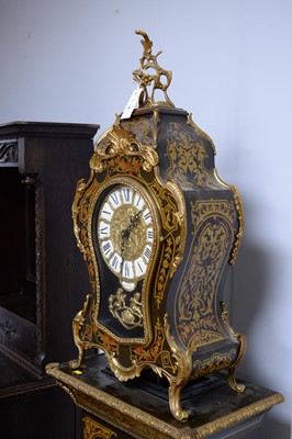 Lot 80 - An ornate  inlaid Continental Louis XIV-style clock on pedestal