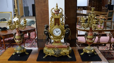 Lot 81 - An French style cast, brass, bronzed and marble three-piece clock garniture by Lancini.