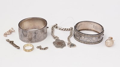 Lot 204 - A silver curb link bracelet with fob; an apple pattern charm and other items.