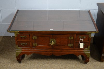 Lot 27 - An Asian coffee table; and an Asian low cupboard.