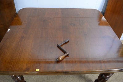 Lot 16 - An early 20th Century walnut extending dining table.