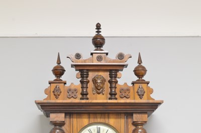 Lot 108 - A Viennese walnut and beechwood wall clock.