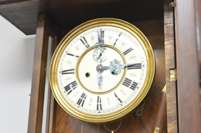 Lot 108 - A Viennese walnut and beechwood wall clock.