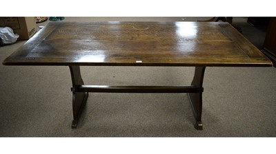 Lot 55 - A rectangular oak plank top refectory dining table.