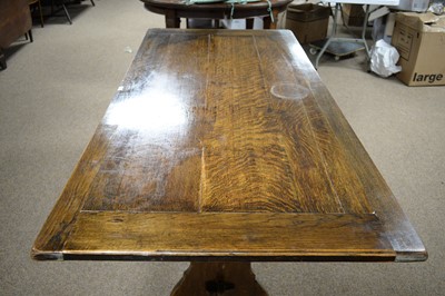 Lot 55 - A rectangular oak plank top refectory dining table.