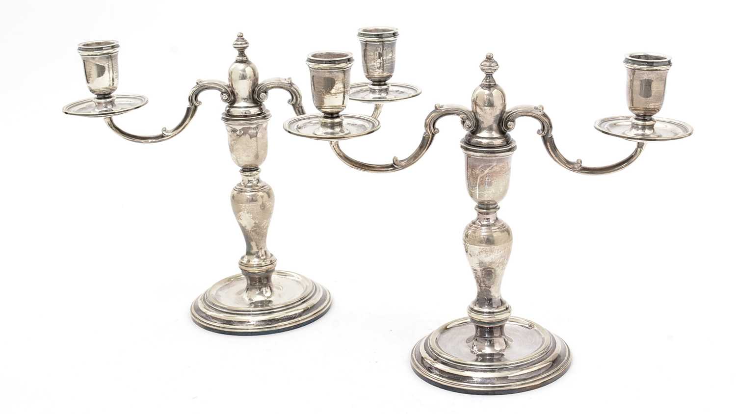 Lot 190 - A pair of Elizabeth II silver twin light candelabra.
