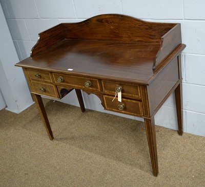Lot 58 - An early 20th Century mahogany and satinwood banded desk.